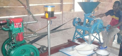 Photo: man operating grinding machine